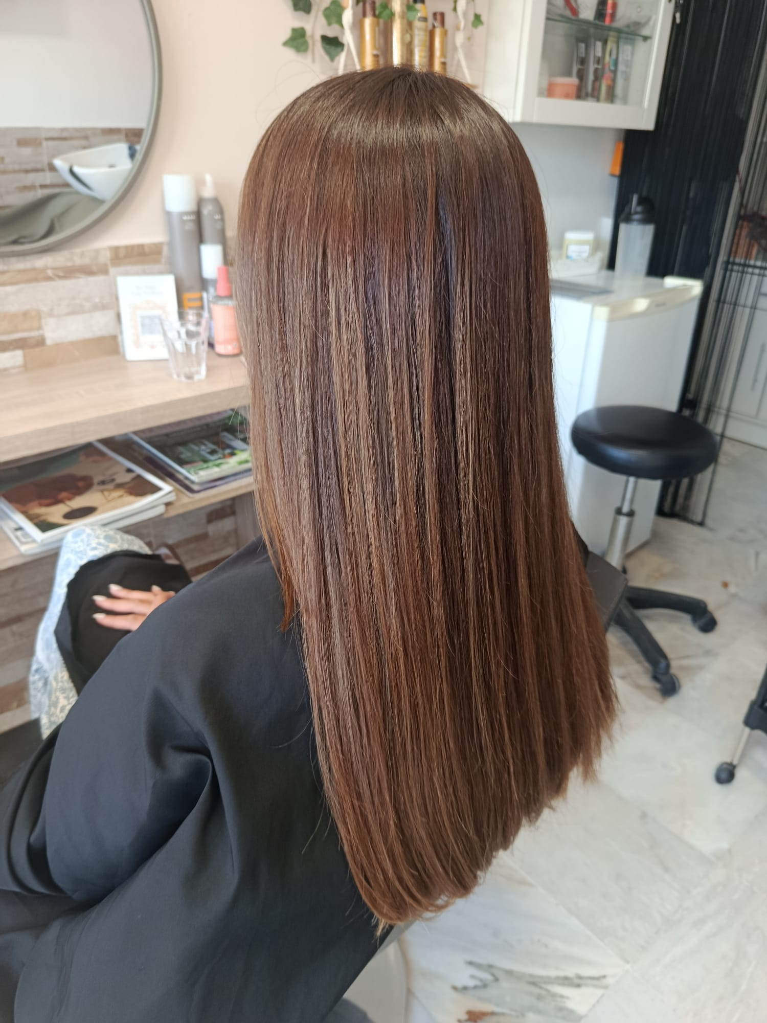Sleek straight chocolate brown hair with an all-over colour