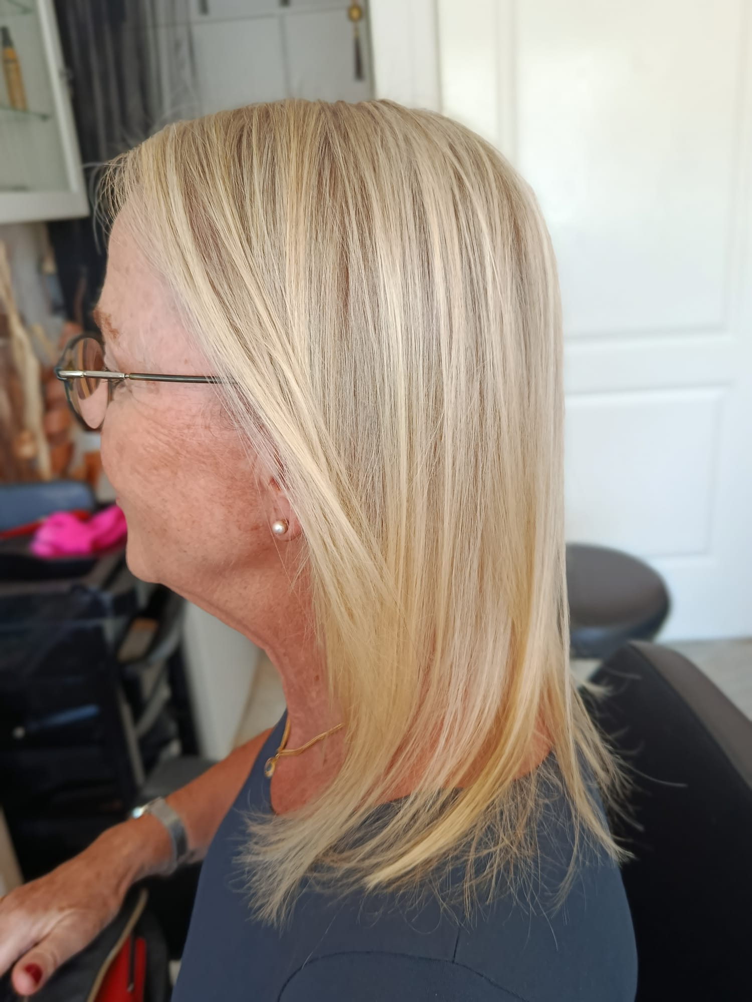 Bright blonde balayage on a shoulder-length cut