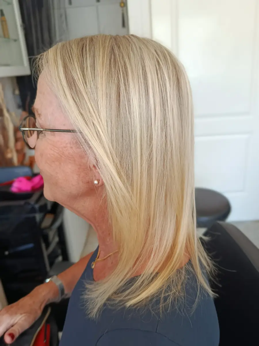Bright blonde balayage on a shoulder-length cut